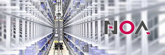 A load-lifting crane in a row of a high-bay warehouse. On the right is the logo of KEB NOA