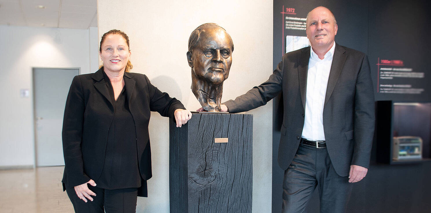 Gabriele Tavella and Thomas Brinkmann with the bust of their father