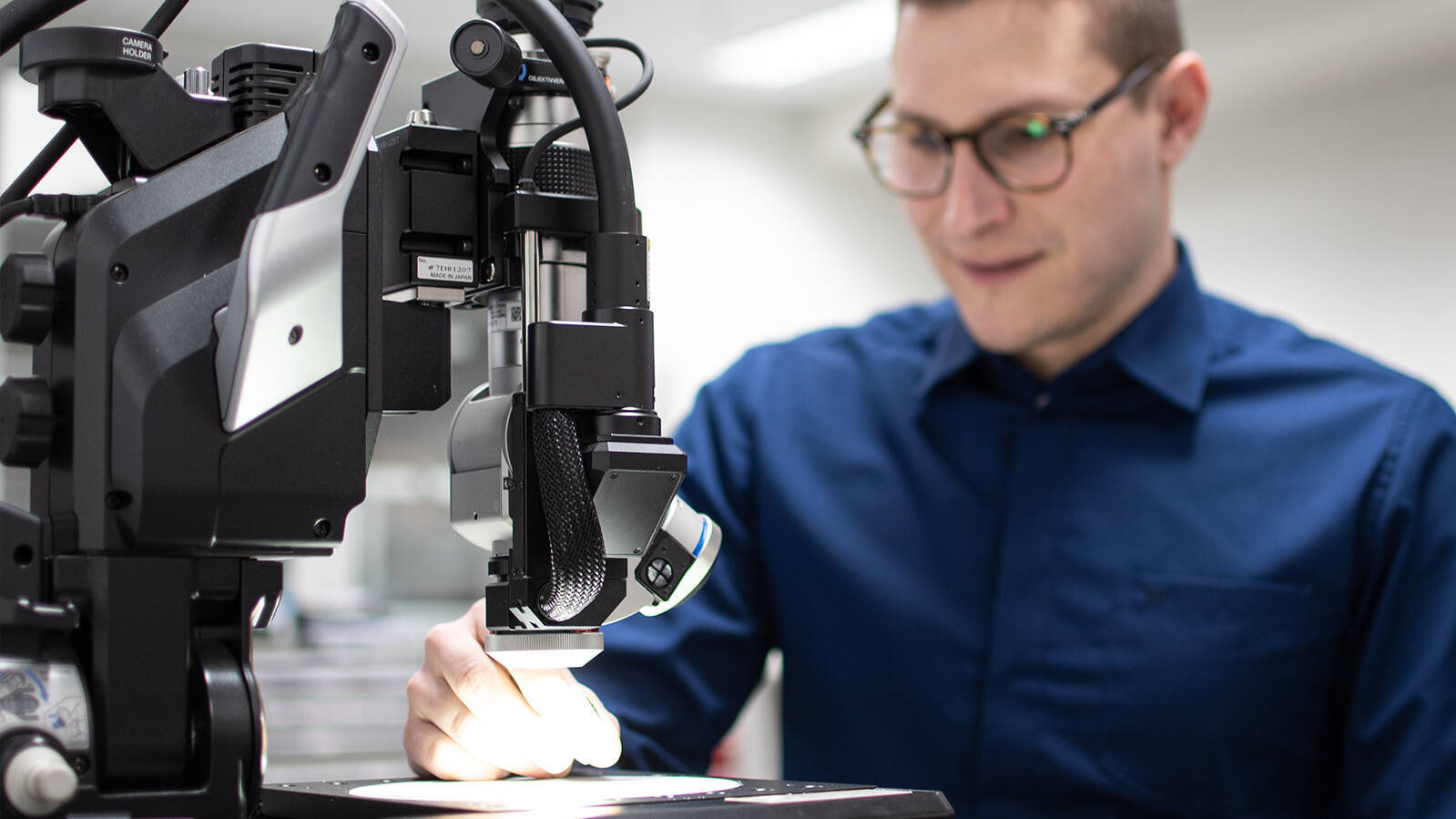 A man checks at the microscope 