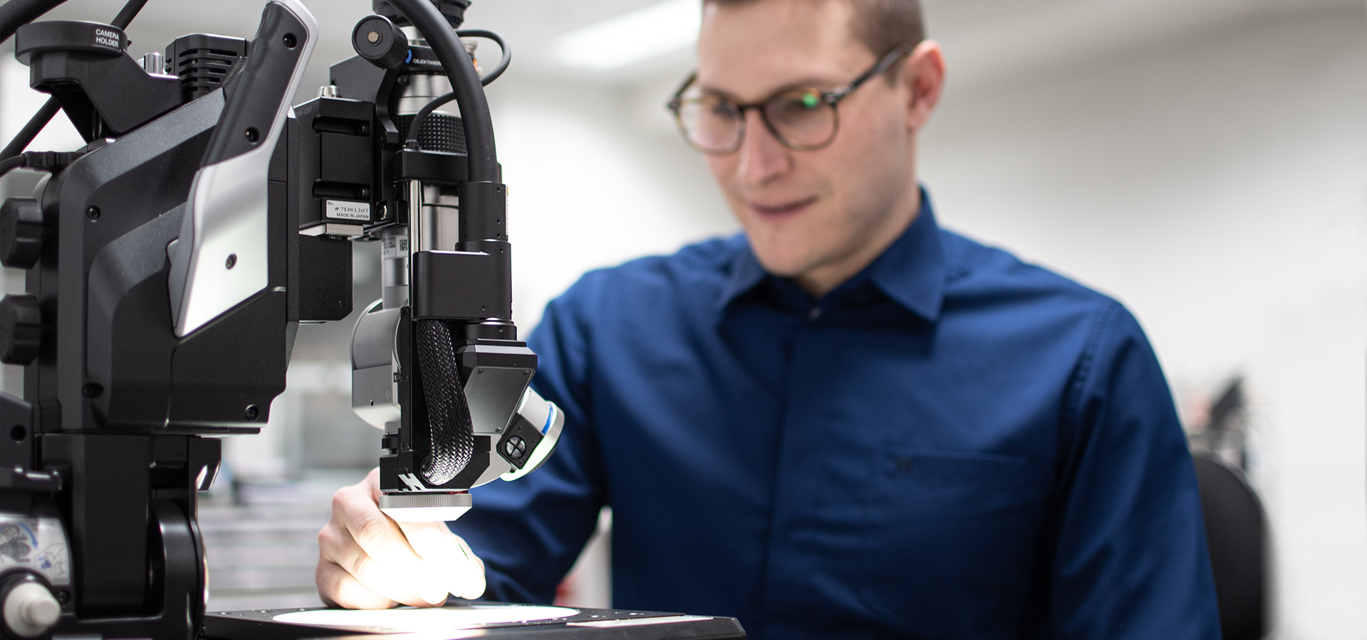 A man checks at the microscope 