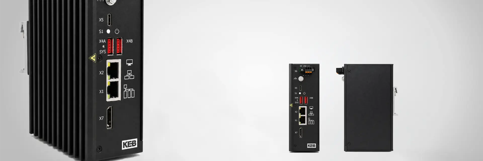 The C6 E32 industrial PC, distributed by KEB Automation, from three different angles on a grey background